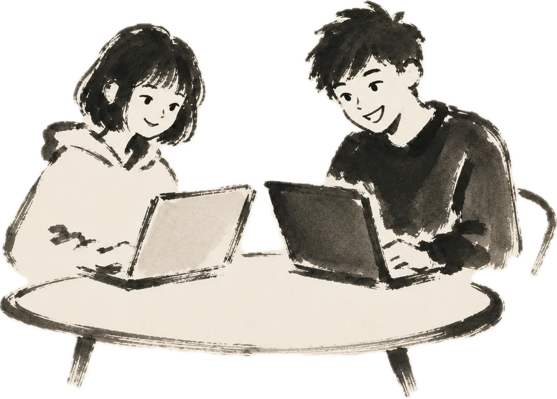 Two people working at laptops